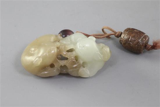 A Chinese pale celadon and pale russet jade group of two badgers and a cub, 18th/19th century, width 4.5cm